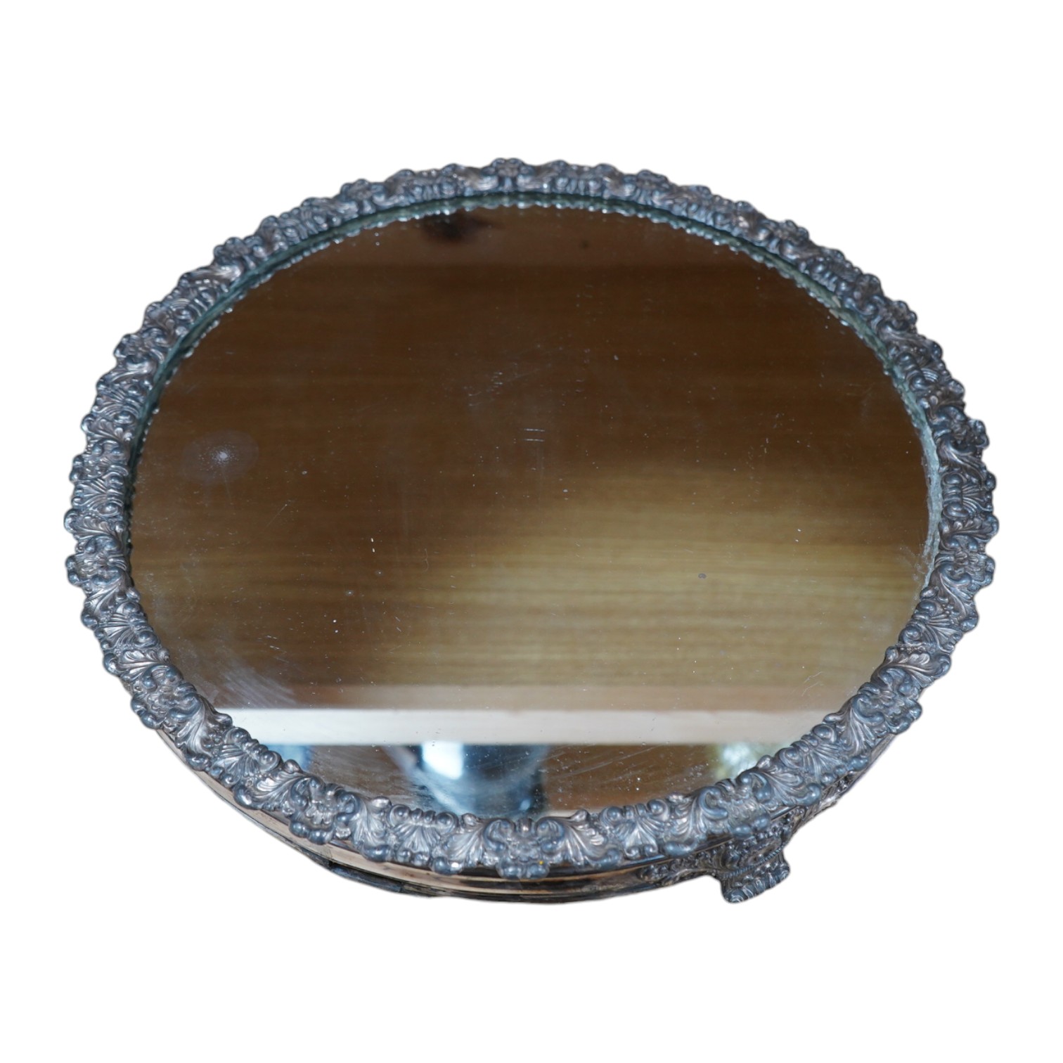 A Victorian silver plated and mirrored circular wedding cake plateau, 38.5cm diameter. Condition - plate worn in places